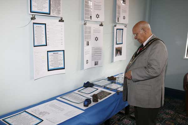 NEVER AGAIN: Deputy Mayor Leon Gardiner studies the poetry exhibition 