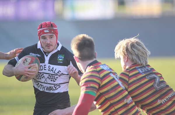 Rory Budina attempts to break through some Quins tackles
