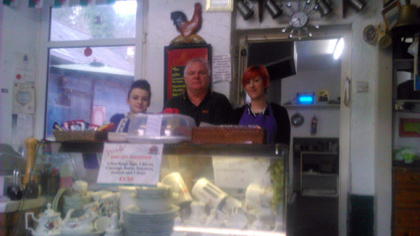 DEFIANT: Royston lewis with employees Naomi Powis (l) and Aimee Coombs at Victoria's Cafe,Newbridge