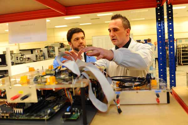 Axiom apprentice Jeff Lee (right) with Secretary of State for Wales Stephen Crabb