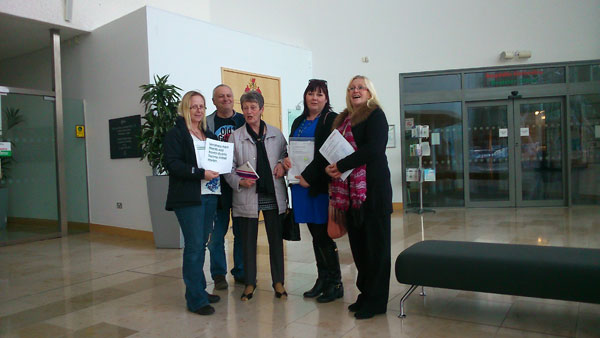 COMMUNITY: Lansbury Park residents join Cllr Elaine Forehead to hand in the petition to Caerphilly councillors