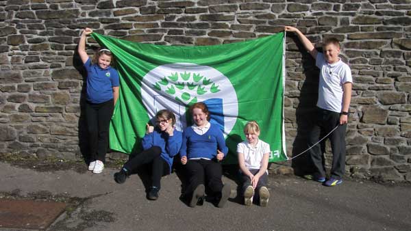 GREEN: Ynysddu pupils celebrate their award