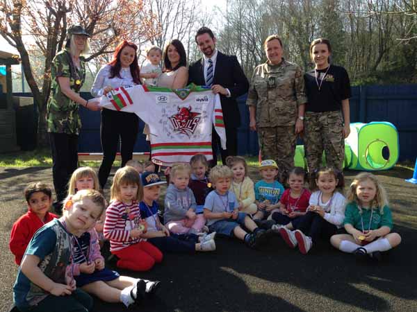 The children with Kris Agland, from the Cardiff Devils, (centre) and Finlay and mum Gemma (centre left)