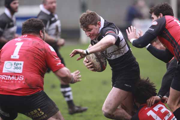 TIGHT GAME: Matthew John tries to break through some Cross Keys tacklers 