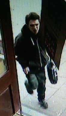 Police would like to speak to this man in connection with the theft of a charity collection box from the Malcolm Uphill pub in Caerphilly town
