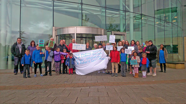 ANGRY: Protesters against the scheme demonstrate outside Caerphilly Council's offices in May