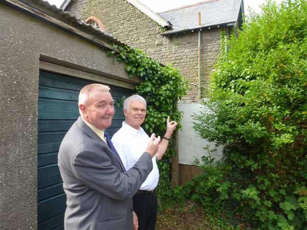 Llanbradach councillors Rob Gough and Colin Mann on the site of the planned new health centre