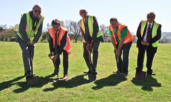 Mayor Cllr David Carter, Director of the Eisteddfod Aled Sion, Leader of Caerphilly Council, Cllr Keith Reynolds, Vice-Chair of Urdd Executive Committee Osian Rowlands and Caerphilly Cabinet Minister Cllr Ken James cutting the first sod on the Urdd National Eisteddfod site in Llancaiach Fawr