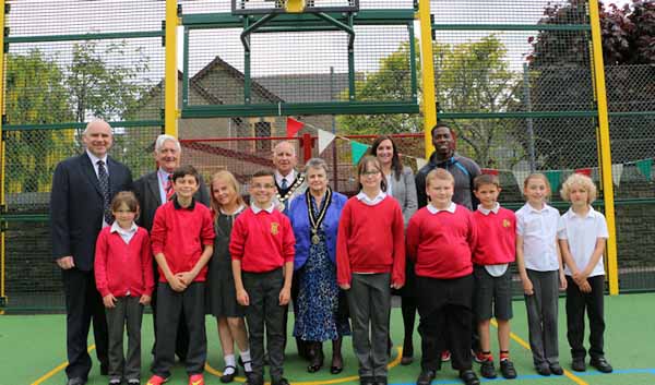 Darren Morgan (far left) and Christian Malcolm (right) with dignitaries, school staff and pupils