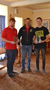 Sam (left) and Aaron Jones (right) receive their awards from 1989 and 1990 British Rally Champion David Llewellin