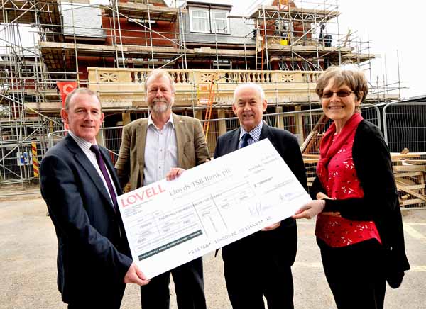 COMMUNITY: Meurig Jones presents the cheque to Ms Hughes 