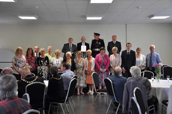 AWARDED: Members of the Aber Valley Heritage Group receive their Queen's Award for Voluntary Service