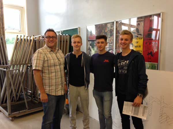 CONGRATULATIONS: St Martin's deputy head Marc Yeoman with Nathan Eedy (10 A*/A), Mikey Farmer (6A*/A) and Sean Eedy (9 A*/A)