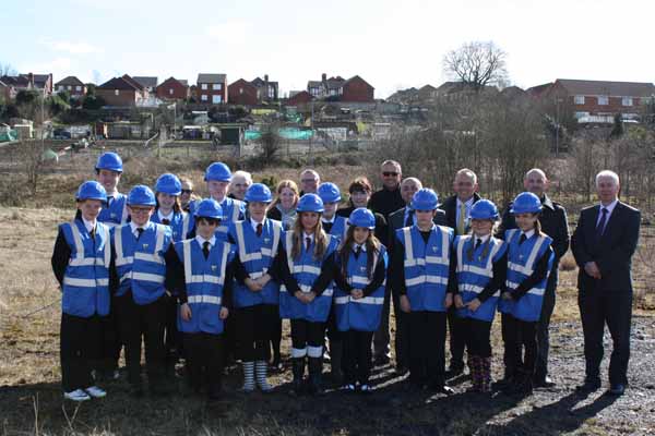 Pupils from Oakdale and Pontllanfraith schools during a visit to the site of their new school and, inset, what the building will look like once finished