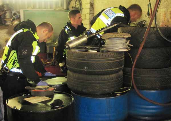 Officers raid a premises as part of Operation Leek