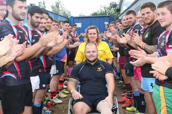 FIGHTER: Jordan Jevons receives a guard of honour at the match at Treharris RFC