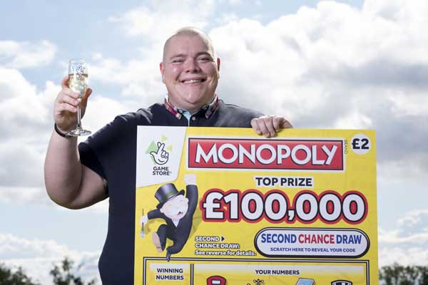 WINNER: Shaun Allen celebrates his &pound;100,000 scratchcard win