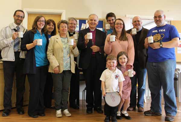 COMMUNITY: Staff and volunteers of St Gwladys Church with the Archbishop of Wales, Dr Barry Morgan (centre)