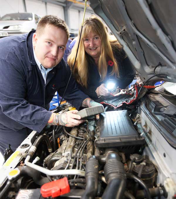 OPEN YOUR BONNET: Learner Christopher Philips with Julie James AM at the training centre launch