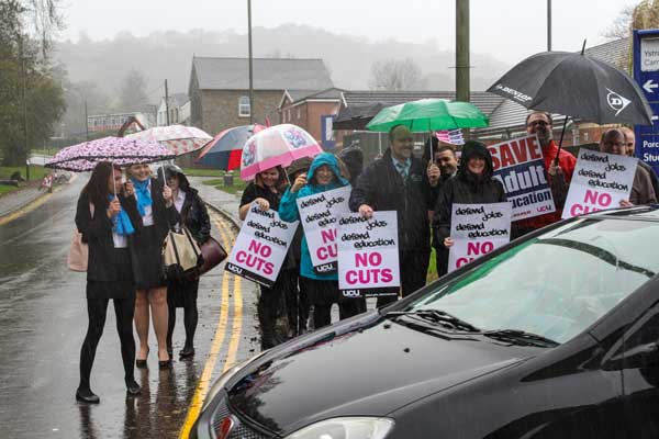 DEFIANT: Students and lecturers braved the elements during the lunchtime protest. Picture by Joanneburgessphotography.com