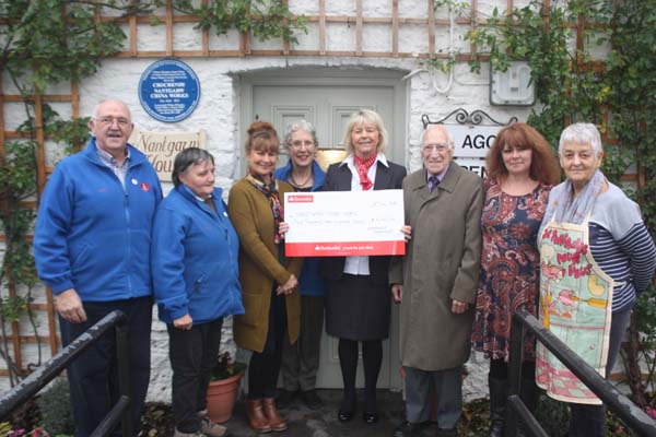 CHEQUE PLEASE: Julie Brock of the Caerphilly Branch of Santander presenting the cheque to members of the Nantgarw China Works Trust.