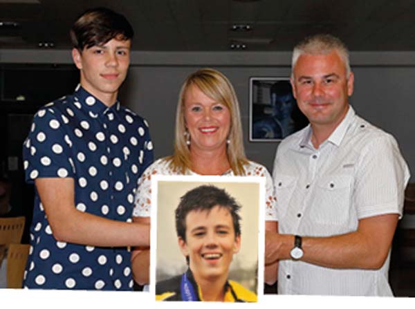 June Thomas with her husband Grant and son Owain with a picture of Jack