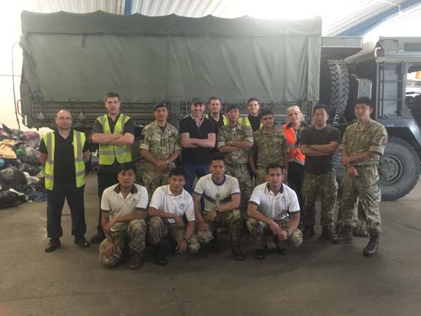 The Gurkhas with staff from Cash For Clothes
