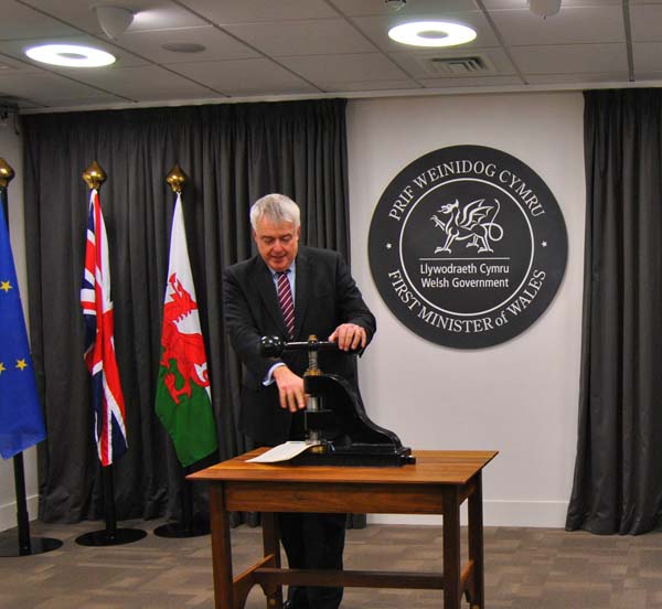 ASSENT: First Minister Carwyn Jones applies the Welsh Seal to the new housing law
