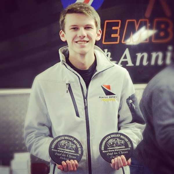 Aaron Jones shows off second placed finish trophies at Rali Cwm Gwendraeth