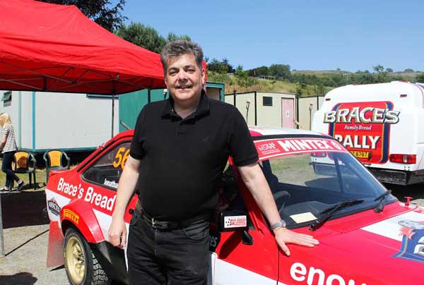 Driver Jonathan Brace poses with his Ford Escort MK2
