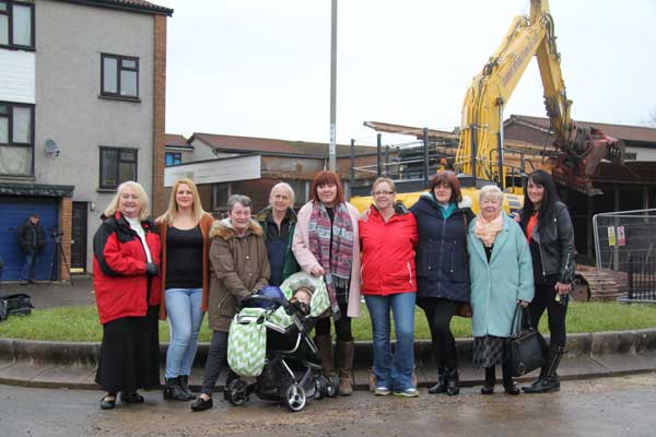 TAKING STEPS FORWARD: Lansbury Matters members and local councillors celebrate the demolition of the old community centre.