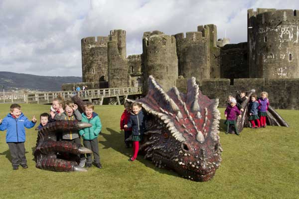 SNARED: Children from Ysgol Ifor Bach in Abertridwr enjoy themselves at the Castle dragon