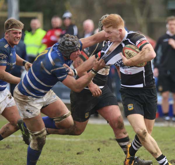 GRAPPLE: Bedwas’ James Dixon fends off a tackle