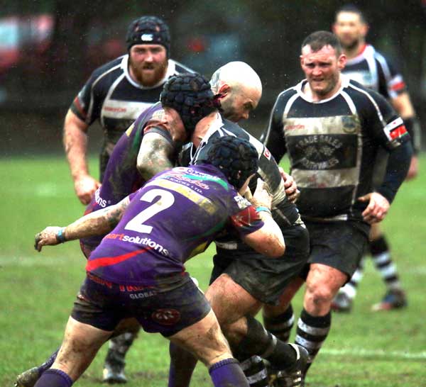 CRASH: Bedwas hooker Alun Rees takes the force of two tackles 
