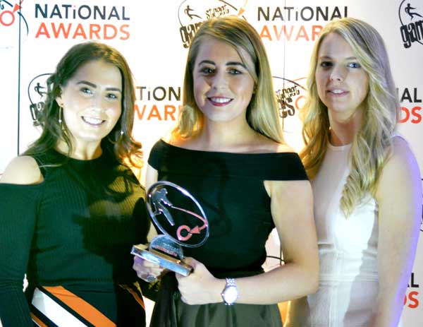 AWARD: Lauren Thomas (centre) with the Caerphilly Us Girls team