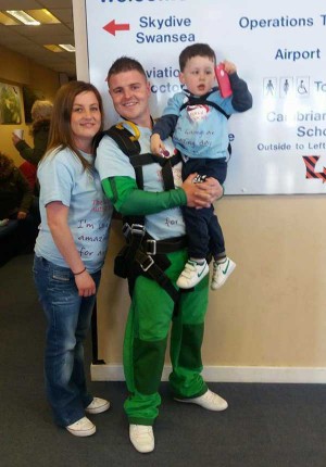 Ross Mason-Price (centre), 27, with partner Danielle Meredith (left), 25, and son Kaden (right), three.