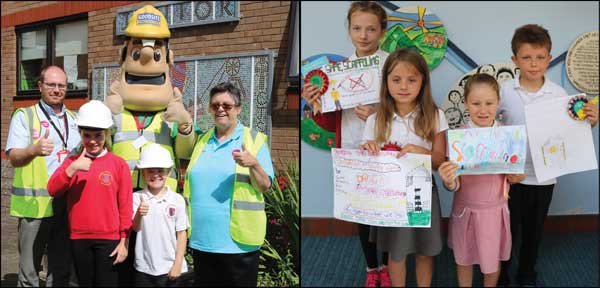 HEALTH AND SAFETY: Pupils from Cwmaber Infant and Junior Schools with Ivor Goodsite and their safety posters, outlining the dangers of playing in a building site
