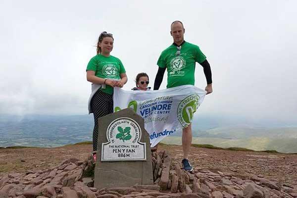 ACHIEVEMENT : Abi-Jean Wood, left, with her father Dean and five-year-old sister Billie celebrate getting to the top of Pen-y-Fan