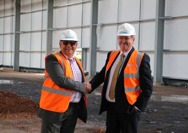 Cllr Ken James, Cabinet Member for Regeneration, Planning and Sustainable Development with Mark Pulman (right), Managing Director of IG Doors at the new site in Oakdale