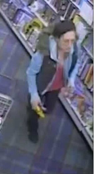 Police want to identify this woman after a theft at WH Smith in Caerphilly town