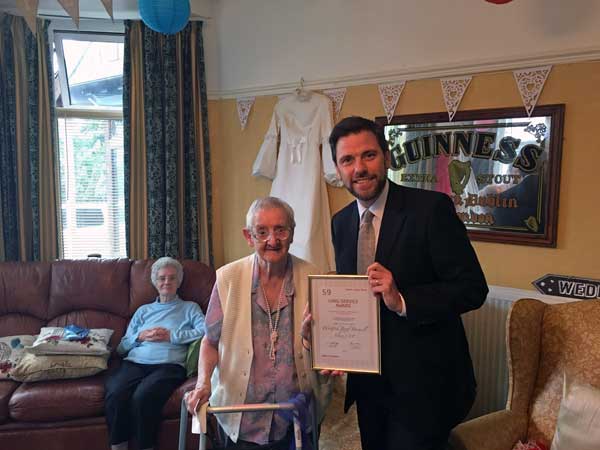 DEDICATED: Islwyn MP Chris Evans presents Mrs Banwell with an award for her long service to the Labour Party