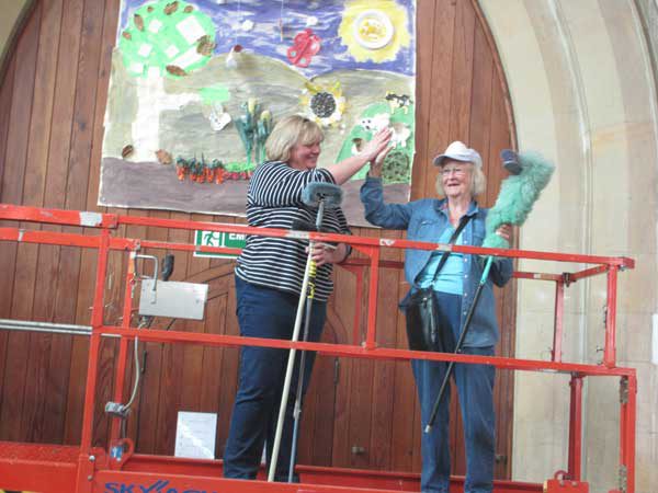Barbara Turner and Allyson Hanks on the cherry picker