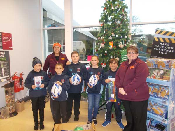Newbridge Rugby Under-10s with their training equipment at Sainbsury's Pontllanfraith