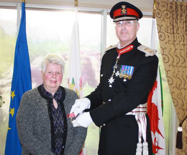 HONOURED: Pamela Guy is presented with her British Empire Medal by Brigadier Robert Aitken CBE, the Lord-Lieutenant of Gwent