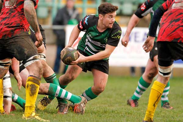 HALF CENTURY: Caerphilly scrum-half Jac Jonathan uses the ball