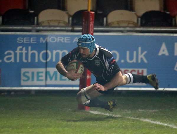 Rory Budinha crosses for Bedwas in their Foster's Challenge Cup pool game against Newport