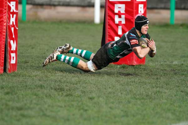 UNLUCKY FOR SOME: Caerphilly flanker Tom Axenderry crosses for one of his side’s 13 tries
