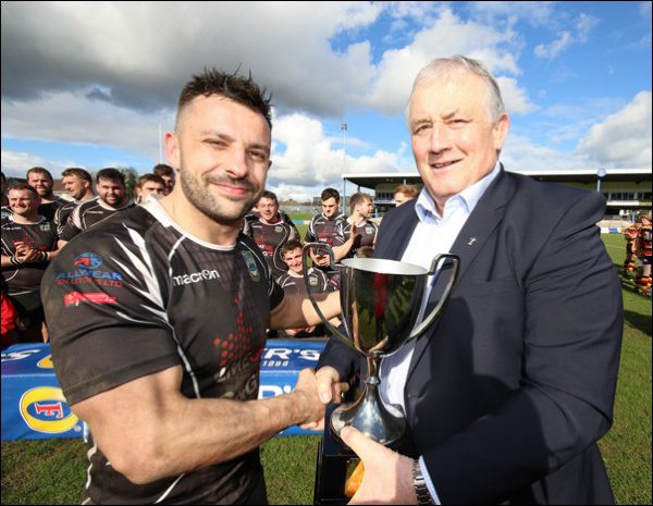 Bedwas captain Nicky Griffiths receives the Foster's Challenge Cup