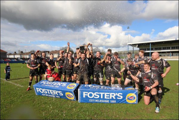 Bedwas players lift the Foster's Challenge Cup after defeating Carmarthen Quins