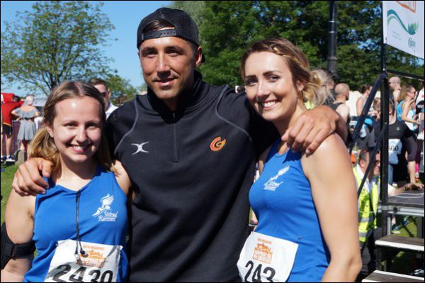 Charlie Webber and Abby Cousins of Ystrad Runners with Gavin Henson at the Bryn Meadows Caerphilly 10k